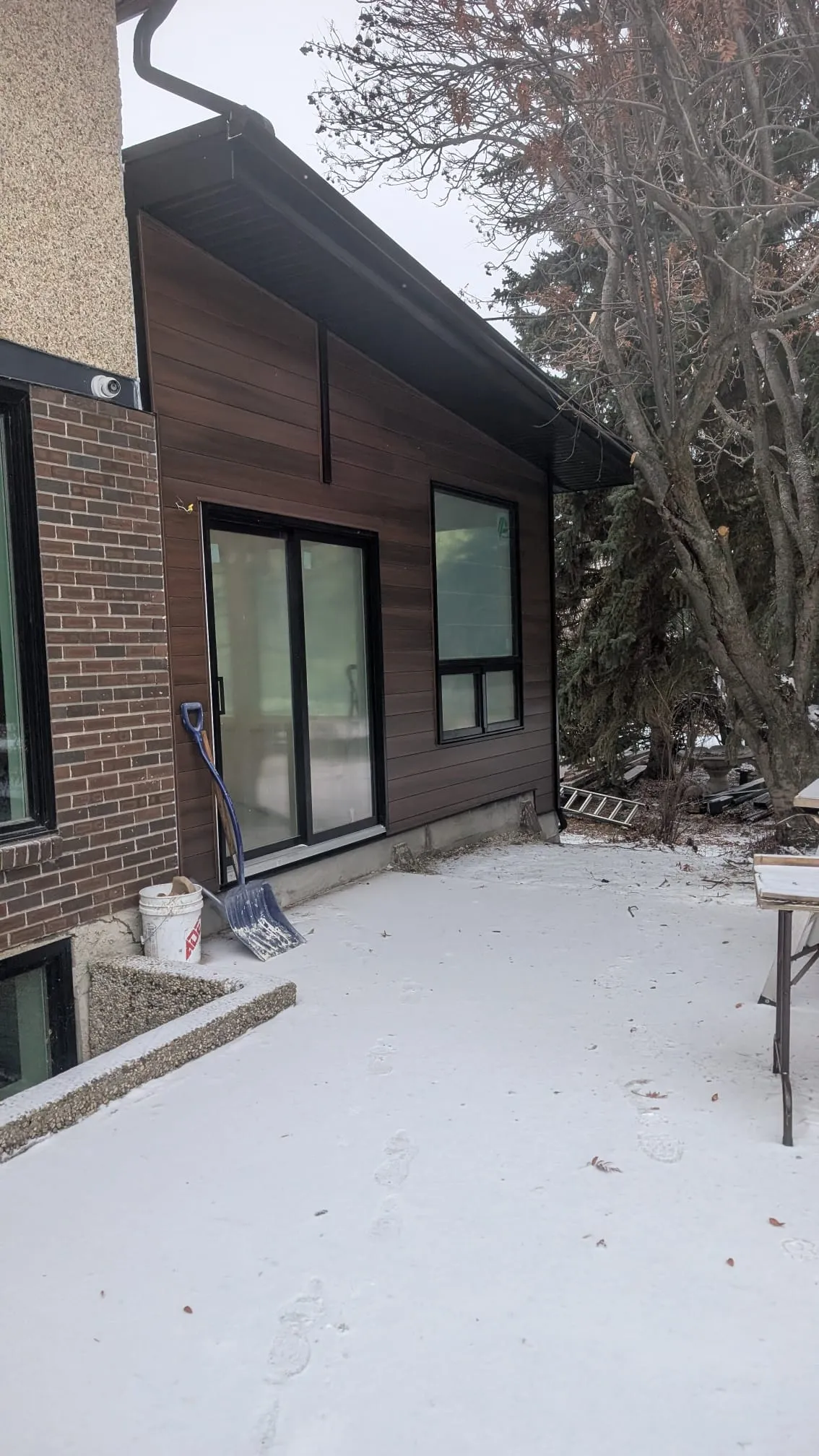 ACR Construction dark siding and brick combination on residential home