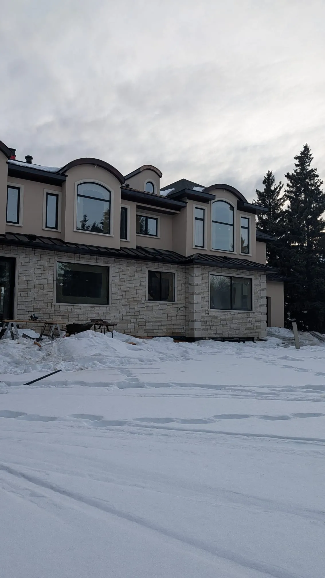 ACR Construction luxury stone and stucco exterior cladding on Edmonton home